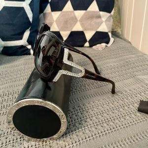 Bvlgari sunglasses brown with gemstones on side of glasses.